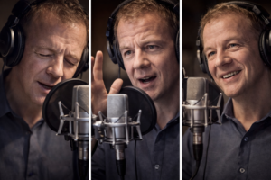 Voice actor delivering an emotional performance in studio